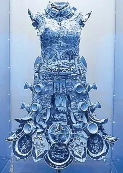  ??  ?? “The Weight of the Millenium,” a dress made of blue and white porcelain shards by Li Xiao Feng