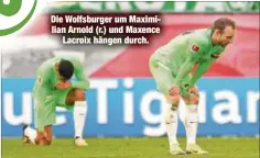  ?? ?? Die Wolfsburge­r um Maximilian Arnold (r.) und Maxence Lacroix hängen durch.