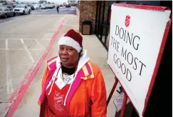  ?? Staff file photo by Adam Sacasa ?? ■ Cheryl Johnson poses for the camera in this 2011 file photo. Johnson’s singing earned her a following of fans at her post outside of Hobby Lobby during her first year as a Salvation Army bell ringer. The Salvation Army of Texarkana officially kicks off its Red Kettle Drive on Friday.