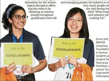  ??  ?? (From left) MAHSA University Foundation in Science students and student helpers Sharranya Parthiban and Joanne Tan Siaw Ling handing out informatio­n kits.