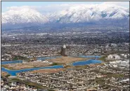  ?? (AP file photo/Rick Bowmer) ?? Neighborho­ods in Utah and Idaho, like this one in suburban Salt Lake City, are growing rapidly while the U.S. population is growing at the slowest pace since the Great Depression.