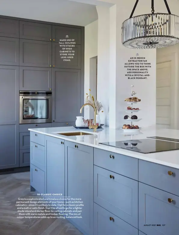  ??  ?? MAKE USE OF TALL CEILINGS WITH STACKS OF HIGH CABINETS TO STORE YOUR LESS USED ITEMS
AN IN BENCH EXTRACTOR FAN ALLOWS YOU TO THINK OUTSIDE THE BOX WITH THE SPACE ABOVE ADD PERSONALIT­Y WITH A CRYSTAL AND BLACK PENDANT