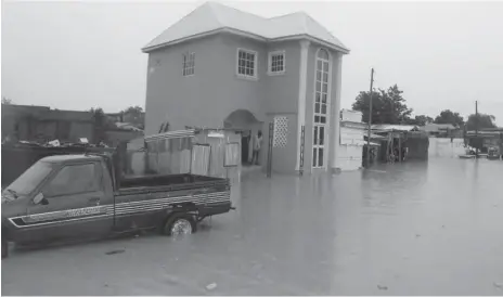  ??  ?? A house taken over by flood at Bayan-Kara area of Birnin Kebbi