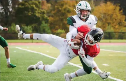  ?? JAMES BEAVER/FOR DIGITAL FIRST MEDIA ?? Central Bucks East’s Chris Lochetta (8) makes an acrobatic catch down the field for a big gain in a game against Pennridge on Saturday night.