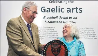  ??  ?? Flora MacDonald receives the prize from Sir Ian Macdonald.