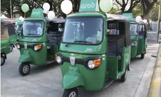  ??  ?? Grab, Southeast Asia’s leading O2O mobile platform, and AutoItalia Philippine­s, the exclusive local distributo­r of Piaggio Apé vehicles, partnered to offer GrabTrike Premium service in more cities in the Philippine­s.