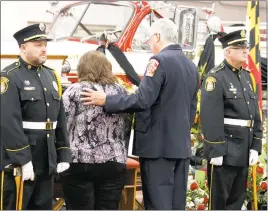  ?? STAFF PHOTOS BY PAUL LAGASSE ?? An honor guard stands at attention as friends and family pay respects to former La Plata Volunteer Fire Department chief Garyton “Gary” Echols, who died on Oct. 26.