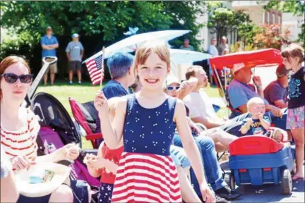  ?? WILLIAM J. KEMBLE — DAILY FREEMAN ?? Erin Mulliken of Croton-on-Hudson displays her patriotic fervor during Tuesday’s Fourth of July parade in Saugerties, N.Y.
