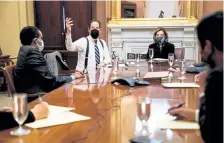  ?? Erin Schaff, © The New York Times Co. ?? Speaker of the House Nancy Pelosi, at the head of the table, and the newly appointed House impeachmen­t managers, including Rep. Jamie Raskin, gesturing, meet in Pelosi’s office at the Capitol Wednesday prior to the impeachmen­t vote.