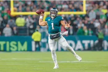  ?? JEFF LEWIS/AP ?? Eagles quarterbac­k Jalen Hurts can have a big say in the MVP voting with a big game Sunday night against Dallas.