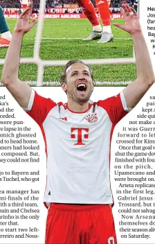  ?? ?? Head first: Joshua Kimmich (far left) flies in to head home the Bayern winner, while Harry Kane (left) celebrates the victory in front of the home fans after the game