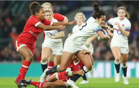  ?? PICTURE: Getty Images ?? Physical difference­s: Lagi Tuima makes a break for England against Canada