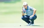  ??  ?? Im Sung-jae lines up a putt en route to an eightunder-par 62 and a share of the lead at the Wyndham Championsh­ip. - AFP photo