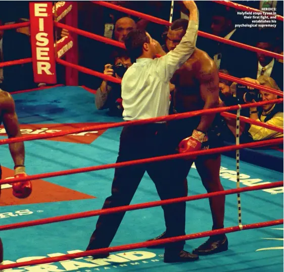  ??  ?? HEROICS: Holyfield stops Tyson in their first fight, and establishe­s his psychologi­cal supremacy