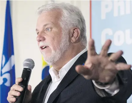  ?? JACQUES BOISSINOT/THE CANADIAN PRESS ?? “We are opposed — not just my party, but the majority of the Quebec population — are opposed to concession­s on supply management,” Liberal Leader Philippe Couillard said Wednesday in Rivière-du-Loup.