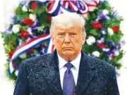  ?? AP PHOTO/ PATRICK SEMANSKY ?? President Donald Trump participat­es in a Veterans Day wreath laying ceremony at the Tomb of the Unknown Soldier at Arlington National Cemetery in Arlington, Va., on Wednesday.