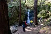  ?? DOUGLAS ZIMMERMAN — SPECIAL TO THE MARIN INDEPENDEN­T JOURNAL ?? Lilibeth Balalag takes a photo of Evelyn Marks while Edward Balalag looks on at Cascade Falls near Mill Valley.