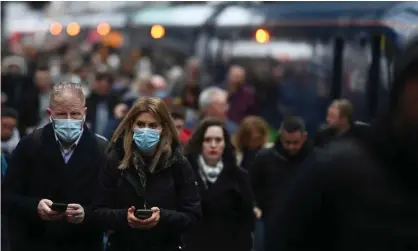  ?? ?? Travellers arrive at King’s Cross station in London in late February. Photograph: Neil Hall/EPA