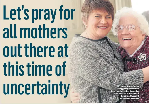  ?? KELVIN BOYES / PRESS EYE ?? DUP leader Arlene Foster is hugged by her mother Georgina Kelly after becoming First Minister at Parliament
Buildings, Stormont