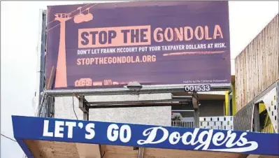  ?? Allen J. Schaben Los Angeles Times ?? A BILLBOARD protesting the proposed Dodger Stadium gondola project looms over Sunset Boulevard.