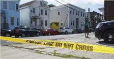  ?? NiColauS CzarneCki / Herald Staff ?? DANGEROUS DRIVING: Police tape remains at the scene on Sixth Street where a person was struck and killed by a car in Chelsea.