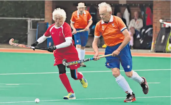  ?? ?? Sticking power: Flexibilit­y, pace and movement on the pitch, and a spirit of camaraderi­e off it, are evident as England over-80s hockey players take on their counterpar­ts from the Netherland­s in Canterbury