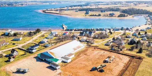  ?? P.E.I. PROPERTY BROTHERS • SPECIAL TO THE GUARDIAN ?? This drone shot captures the beginning of constructi­on of a new Olympic-sized rink to replace the North Star Arena in North Rustico.