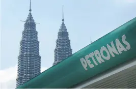  ?? GOH SENG CHONG / BLOOMBERG ?? Petronas, Malaysia’s only Fortune 500 company, expects to lay off more than 40 people in Canada after the decision to pull out of the Pacific NorthWest LNG project in B.C.