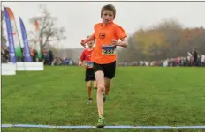  ??  ?? James Foot of Bray Runners A.C. crosses the line to win the boy’s U12 event during the Irish Life Health National Senior, Junior & Juvenile Even Age Cross Country at Abbotstown in Dublin.