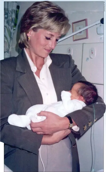  ??  ?? LOVING ARMS:
Diana cradles baby James, still attached to his monitors, during her surprise hospital visit in 1996