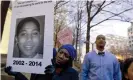  ?? Photograph: Jose Luis Magana/AP ?? Tomiko Shine holds up a poster of Tamir Rice during a protest in Washington in 2014.