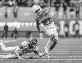  ?? Tim Warner/getty Images ?? Texas running back Bijan Robinson has topped 100 yards in 11 of the Longhorns’ 12 games this season and ranks fourth nationally in rushing touchdowns.