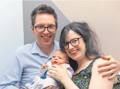  ?? Picture: Dougie Nicolson. ?? Anna Mcfarlane and Gary Phillips at home in Dundee with their son Rory.