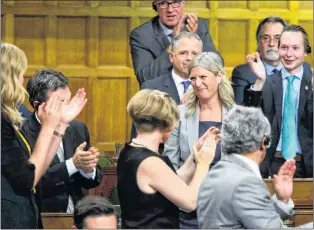  ?? CP PHOTO ?? Ontario MP Leona Alleslev is applauded as she stands to ask a question during question period in the House of Commons on Parliament Hill in Ottawa on Monday.