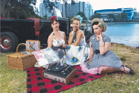  ??  ?? Looking forward to the Cooly Rocks On Vintage Picnic by Jack Evans Boat Harbour are retro picnickers Katrina Lee, Krystal Baggett and Sarah Smith.