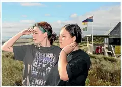  ?? SHANE WENZLICK/STUFF ?? Paris Schlooz, main photo and above left, and sister Maddison say they didn’t assess the risk before they got into trouble in the waves at Muriwai.