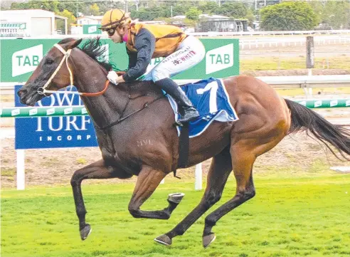  ?? Picture: MIKE MILLS ?? SOFT SPOT: Apprentice rider Zoe White scores a win by a length with Bryan’s Babe in Townsville last week.