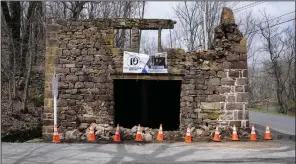  ?? (AP/Matt Rourke) ?? Cones cordon off fallen debris from the historic Taylor’s Mill in Lebanon, N.J., on Friday.