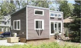  ??  ?? Tiny homes come in all shapes and styles from traditiona­l (below left) to boxy with a slight pitched roof (above). Left photo: Elaine Walker’s parents enjoyed playing house in their daughter’s cottage-inspired home with its dollhouse porch.