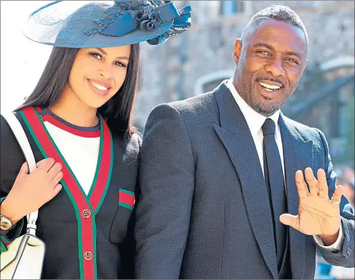  ??  ?? Idris Elba with his new wife Sabrina Dhowre pictured at the wedding of Prince Harry and Meghan Markle at Windsor Castle last year