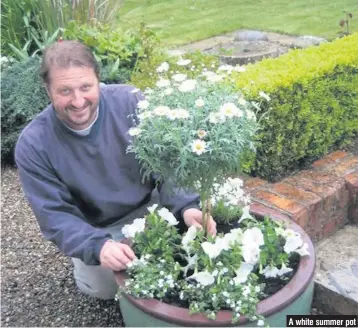  ??  ?? A white summer pot