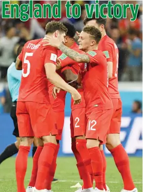  ?? Photo: AFP ?? England’s defender John Stones (L) and England’s defender Kieran Trippier celebrate their win at the end of the Russia 2018 World Cup Group G match between Tunisia and England at the Volgograd Arena in Volgograd yesterday