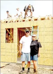  ?? LYNN KUTTER ENTERPRISE-LEADER ?? Bob and Wendy Eiter stand in front of their new house on Harmon Road. This house will be closer to the road, away from the creek that flooded their home in late April.