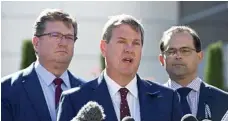  ?? PHOTO: KEVIN FARMER ?? WISHLIST: Toowoomba North MP Trevor Watts (left) and Toowoomba South MP David Janetzki (right) revealed their budget wishlists. They are pictured with opposition leader Tim Nicholls.