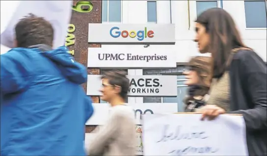  ?? Andrew Stein/Post-Gazette ?? Google employees on Thursday walk out of the company’s office in Bakery Square in Larimer to protest the company’s handling of sexual misconduct scandals.