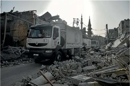  ?? PHOTO: GETTY IMAGES ?? A United Nations aid convoy enters the Douma town of Eastern Ghouta in Syria after the Assad regime halted its offensive.