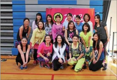  ?? PHOTOS BY LAUREN HALLIGAN — LHALLIGAN@DIGITALFIR­STMEDIA.COM ?? A group of women, including event organizer Mayumi Kato, at the second annual Zumbathon Charity Event for the American Diabetes Associatio­n on Sunday at Saratoga Springs High School.