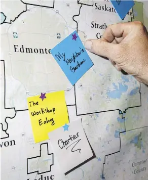  ??  ?? People placed their favourite places to eat on a map during Green Drinks: Farm to Fork at the Yellowhead Brewery.