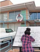  ?? MIKE BROWN/THE COMMERCIAL APPEAL ?? Brooklyn Campbell, 8, reads a marker in honor of Martin Luther King Jr. outside the National Civil Rights Museum on March 31, 2016.