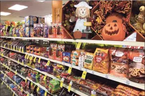  ?? Robert F. Bukaty / Associated Press ?? Halloween candy and decoration­s are displayed at a store in Freeport, Maine, on Wednesday. In this year of the pandemic, with trick-or-treating still an uncertaint­y, Halloween candy were up 13% over last year in the month ending Sept. 6, according to data from market research firm IRI and the National Confection­ers Associatio­n.